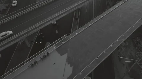 Flight over a transport multi-level interchange, at rush hour, black and white Stock Footage 139395912