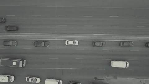 Flight over a transport multi-level interchange, at rush hour, black and white Stock Footage 197943013