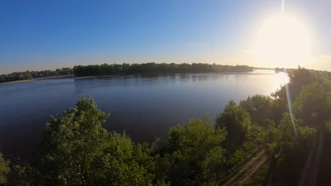 Flight over the trees towards the sun Stock Footage 89451970