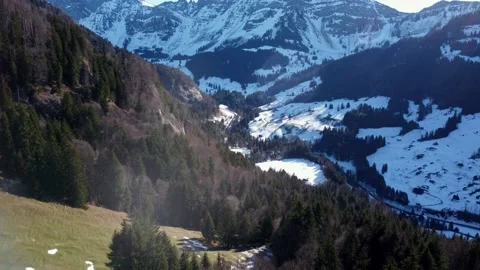 Flight over treetops overlooking Mountain valley in Switzerland Video stock 167983409