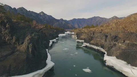 Flight over the turquoise mountain river in spring, aerial Stock Footage 74087807