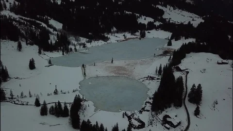 Flight over two winter lakes in Switzerland Stock Footage 115798565