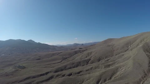 Flight over the valley with hills Stock-Footage 86788199