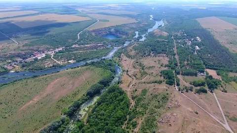 Flight over village, fields and river Stock Footage 80904082