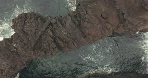 Flight over Volcanic ocean cliff Video stock 68170175