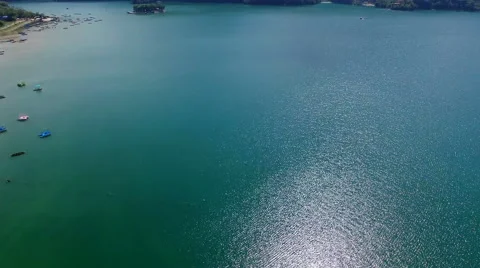 Flight over water in Phewa lake 4k video. Flying Pokhara Valley Nepal. Stock Footage 64824671