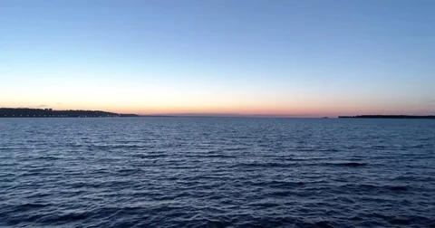 Flight over the water in the sunset Stock Footage 76121003