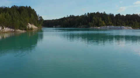 Flight over the water surface of the azure reservoir Stock-Footage 147031430