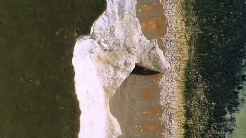 Flight over the white cliffs of Beachy Head and Seven Sisters in England Stock-Footage 103864577