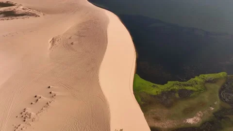 Flight over the White Dunes and Lake Stock Footage 238828159