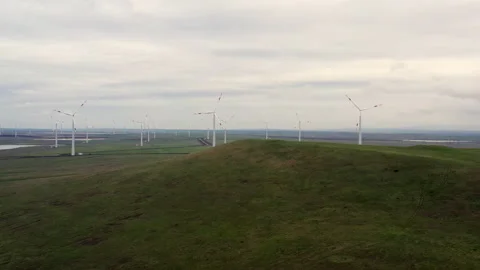 Flight over the windmills installed in the field. Stock Footage 230243348
