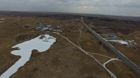 Flight over the winter field, countryside, roads Stock Footage 87422475
