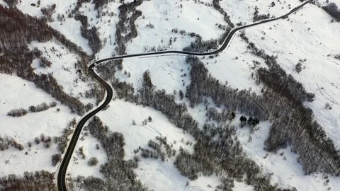 Flight over the Winter Mountain Road, Amazing aerial  view of a  winter Video stock 104831839