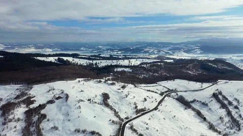 Flight over the Winter Mountain Road, Amazing aerial  view of a  winter Lands Stock Footage 128327818