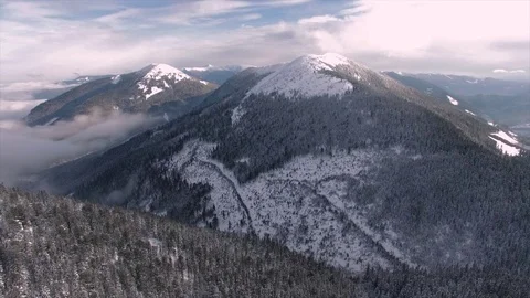 Flight over the winter mountains in the wilderness Video stock 81813832