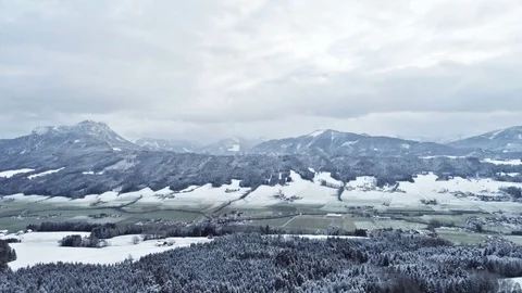 Flight over winter valley with snowy mountains and forest. Austria, Europe Stock Footage 84909248