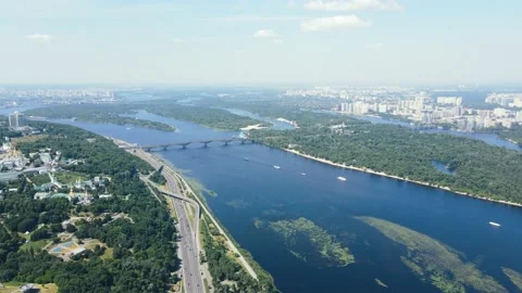 Flight overlooking the big city with skyscrapers and a bridge over the river Stock Footage 163673953