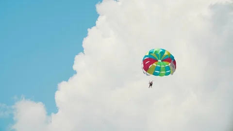 Flight on a parachute, against a white cloud Stock Footage 115855539
