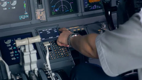 Flight parameters' setting process held by the pilot in a cockpit Stock Footage 90755665