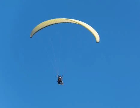 Flight to paraplene in cloudless weather on a background of blue sky Stock Photos