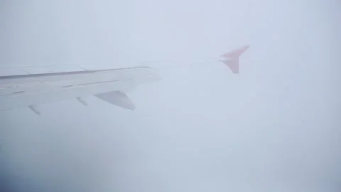 The flight of a passenger plane in cloudy weather. Video stock 252992145