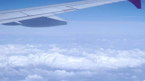 The flight of a passenger plane over the clouds. Stock Footage 246878168