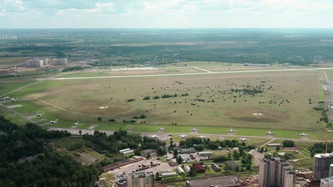 Flight passing small private airport near residential area. Look from above. Stock Footage 141012844