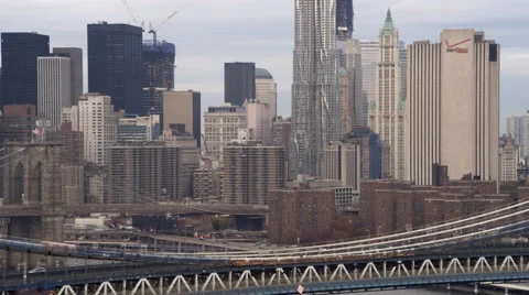 Flight past Manhattan Bridge toward Brooklyn, pulling away to look back at Stock Footage 59165347
