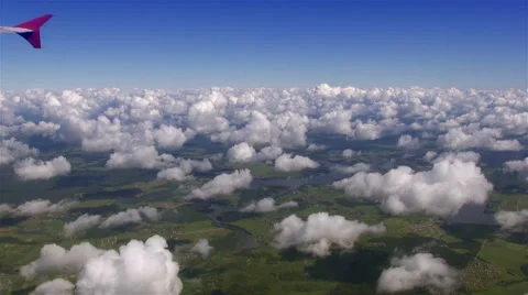 Flight on plain over fluffy clouds Video stock 41462947