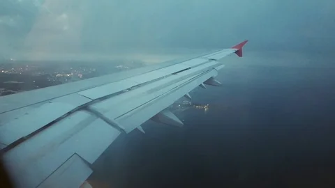 Flight of the plane aircraft through heavy strong dark storm clouds over the sea Stock Footage