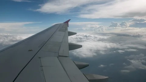Flight of the plane on a flight level, against the background of blue sky and Stock-Footage 103634315
