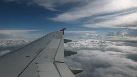 Flight of the plane on a flight level, against the background of blue sky and Video stock 103634439