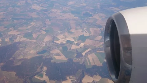 Flight by plane. Low above ground. Beautiful colorful pieces of the earth. Stock Footage 107828894