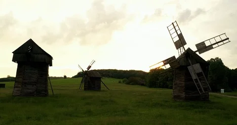 Flight right between the mills above the grass Stock Footage 111873533