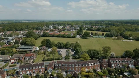Flight right to left over an affluent living area big houses wide roads Stock Footage 296821907