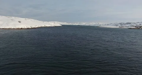 Flight from rippling water close to drowned fishing boats Stock-Footage 101479738