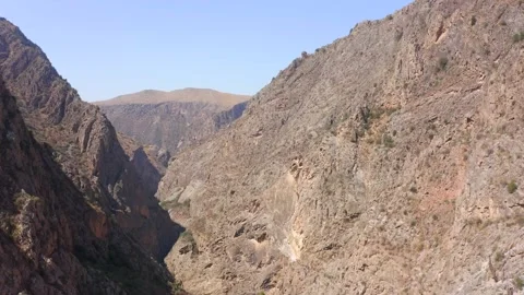 A flight in a rocky gorge. View from the height of the mountains Stock Footage 210187199