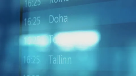 Flight schedule display board showing various international destinations Video stock 328480965