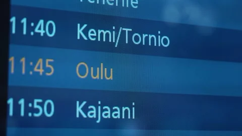 Flight schedule display board showing departure times for Kemi/Tornio, Oulu, Video stock 328480966