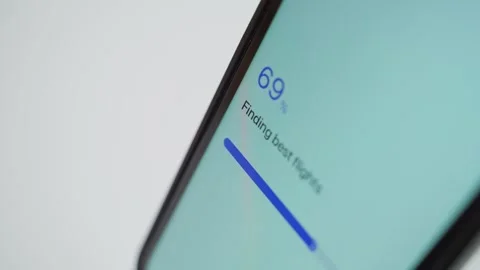 Flight search stuck at 70 percent on a smartphone screen close-up. Frozen Stockbeeldmateriaal 342940040