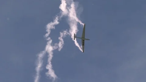 Flight show, glider Marganski Swift S-1, D-3735 shows aerobatics in the sky Stock Footage 101481444