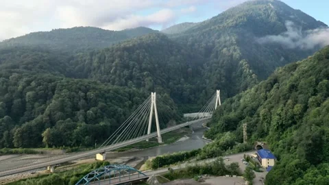 Flight sideways modern cable-stayed road bridge to resort Sochi Russia suburban Vidéo 145574136