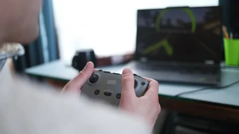 Flight simulator concept. Male hands hold the joystick from the fpv drone Stock Footage 330358001