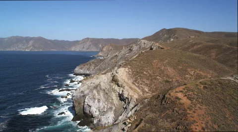 Flight skimming arid coastal cliffs on Catalina Island. Shot in 2010. Stock Footage 59107243