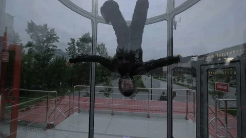 Flight skydiver training in wind tunnel. Training flight in a wind tunnel Stock Footage 82242679