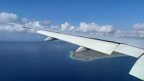 The flight slows down and prepares to land. View from window to wing of plane. Stock Footage 163370181