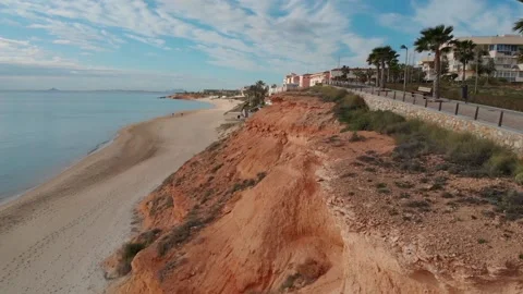 Flight in Spain along the cliffs and the beach in sunny weather. Stock Footage 135350653