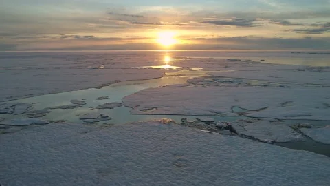 Flight spring Lake Baikal at orange sunset, Huge ice floes nature landscape 4k Stock Footage 202642665