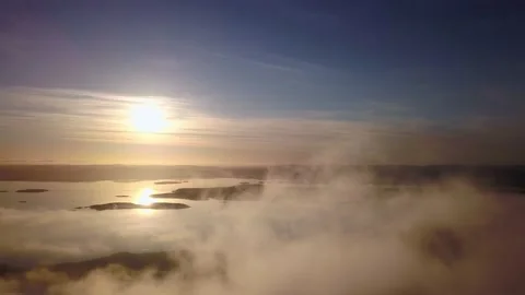 Flight to the sun through the clouds over the sea Stock-Footage 143346974