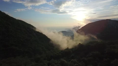 Flight to the sunset among the mountains 스톡 동영상 63998757